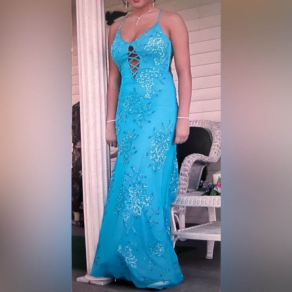 Beaded floor length Prom gown with front cut out